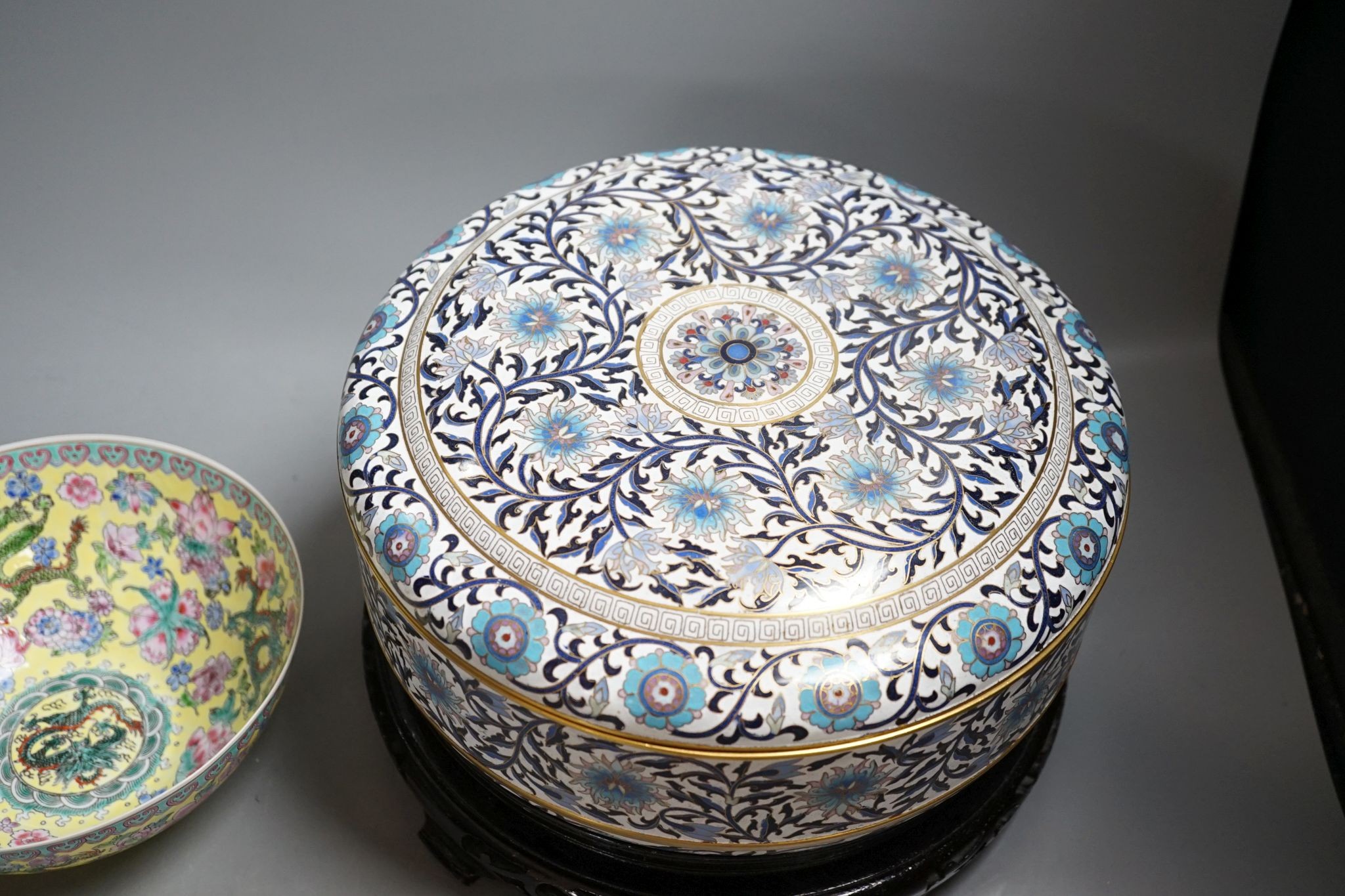 A Chinese cloisonne enamel box and cover, wood stand and a boxed eggshell porcelain bowl